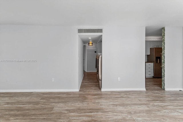 spare room featuring light hardwood / wood-style flooring