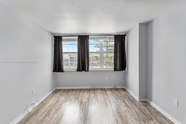 empty room with light wood-type flooring