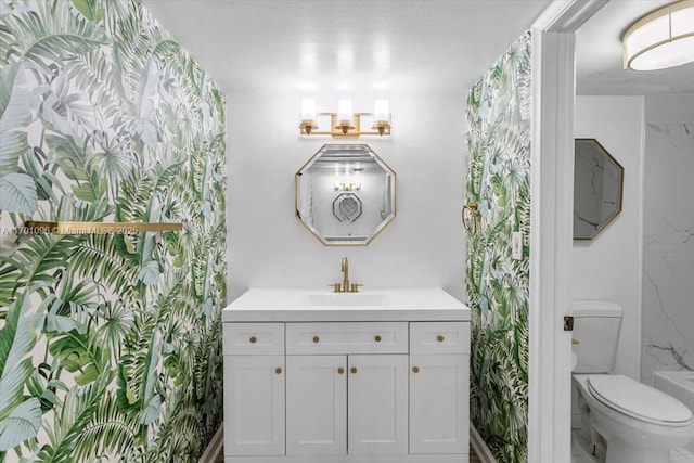 bathroom with vanity and toilet