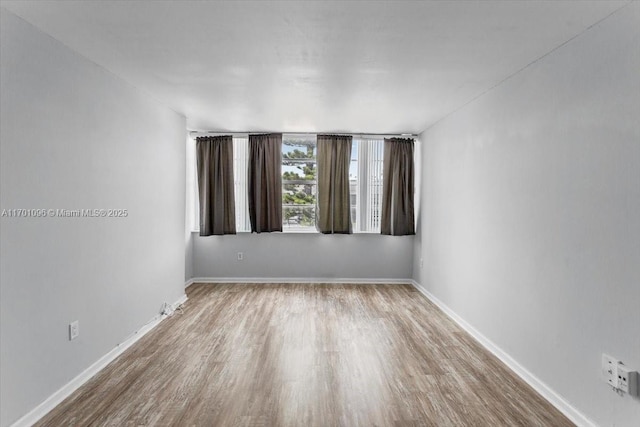 spare room featuring light hardwood / wood-style floors