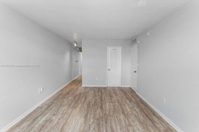 empty room with light wood-type flooring