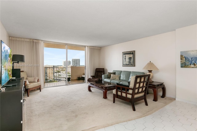 1865 S Ocean Dr Unit 16J, Hallandale Beach, FL 33009 - carpeted living room with floor to ceiling windows, tile patterned floors, and a view of city