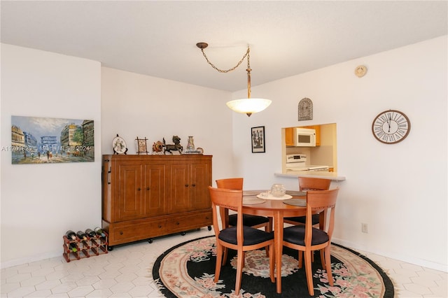 dining area with light tile patterned flooring