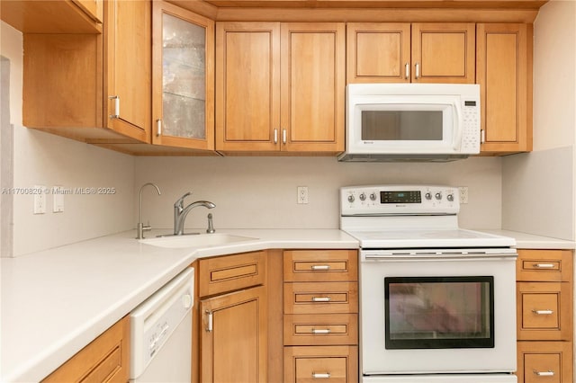 1865 S Ocean Dr Unit 16J, Hallandale Beach, FL 33009 - kitchen featuring white appliances, a sink, and light countertops