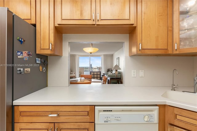 1865 S Ocean Dr Unit 16J, Hallandale Beach, FL 33009 - kitchen featuring white dishwasher, freestanding refrigerator, a sink, light countertops, and glass insert cabinets