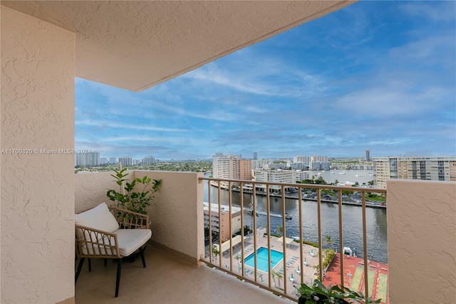 balcony featuring a water view