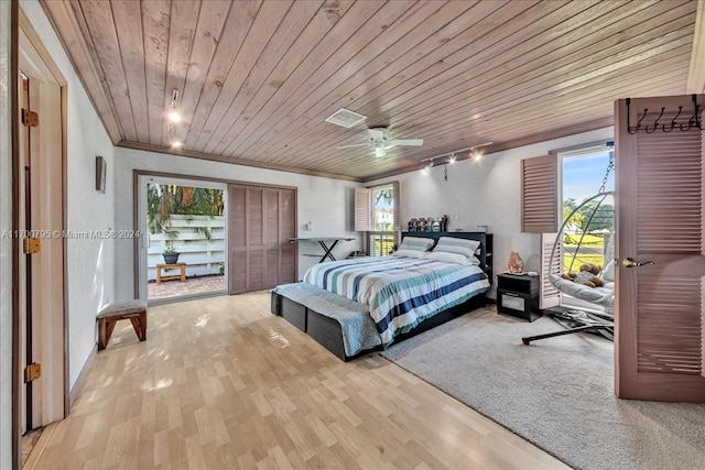 bedroom with light hardwood / wood-style flooring, multiple windows, and wooden ceiling