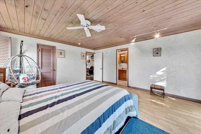 bedroom with ensuite bathroom, ceiling fan, light wood-type flooring, and wooden ceiling