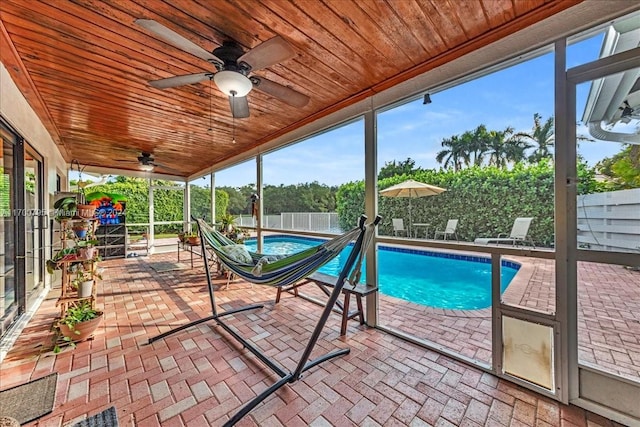 view of swimming pool featuring a patio area and ceiling fan