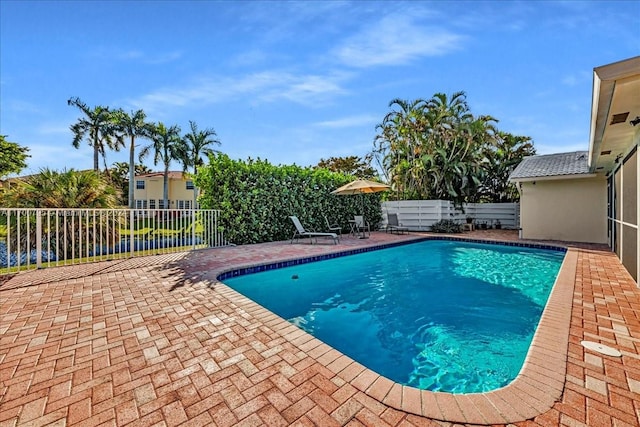 view of swimming pool featuring a patio area