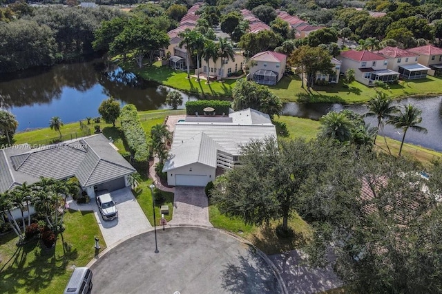 birds eye view of property with a water view