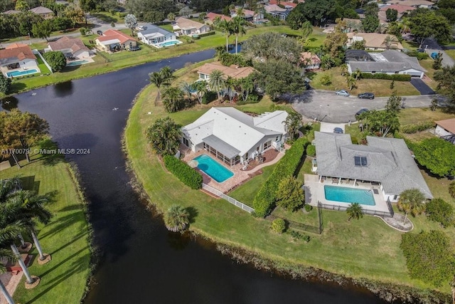 bird's eye view with a water view