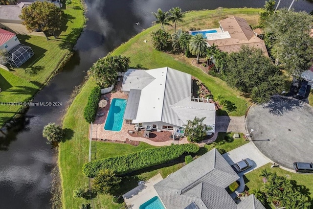 birds eye view of property featuring a water view