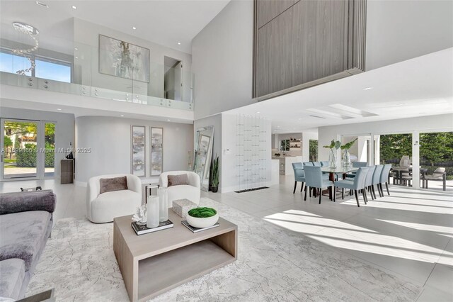 living room with a towering ceiling