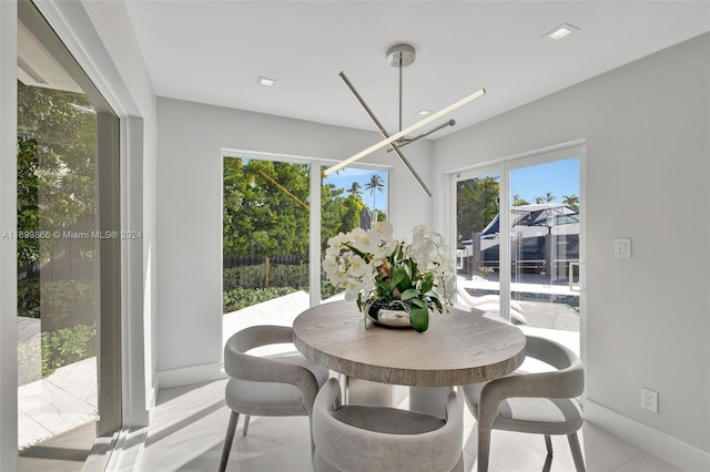 dining area featuring a notable chandelier