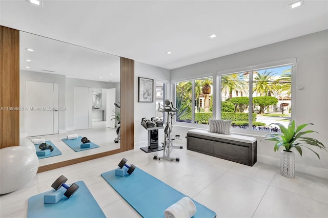 workout room with light tile patterned flooring