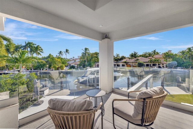 view of dock featuring a water view and a pool with hot tub