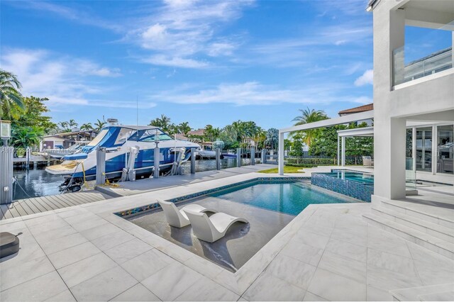 view of swimming pool with an in ground hot tub, a water view, a dock, and a patio area