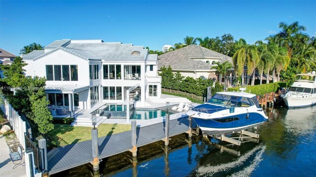 back of house with a water view