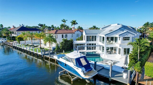 birds eye view of property with a water view