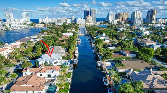 birds eye view of property with a water view