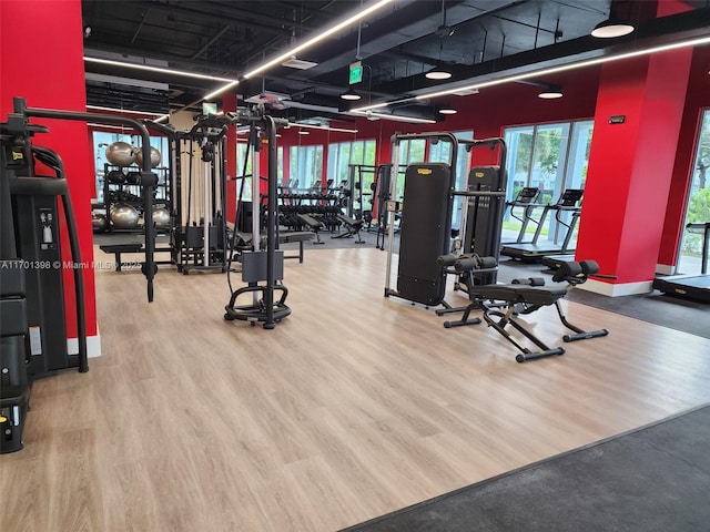 exercise room with wood finished floors