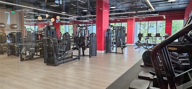 exercise room with wood finished floors