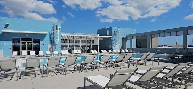 community pool with a patio