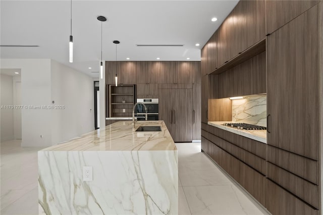 kitchen featuring recessed lighting, a sink, modern cabinets, tasteful backsplash, and marble finish floor