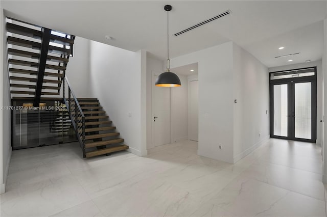 interior space featuring visible vents, recessed lighting, french doors, and marble finish floor
