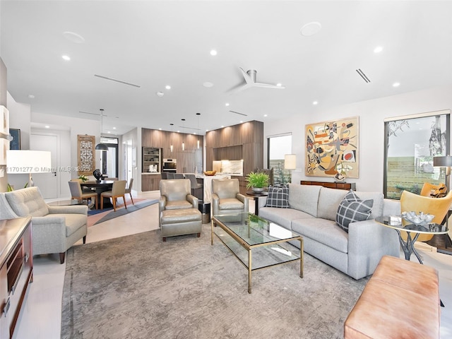 living area with visible vents and recessed lighting