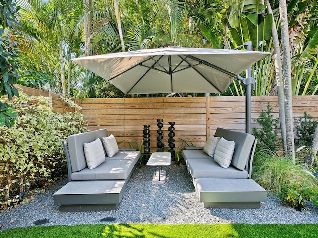 view of patio featuring fence and an outdoor hangout area