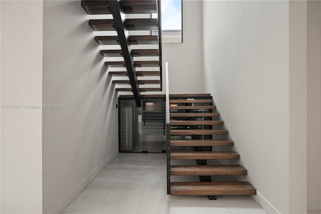 spare room with light wood finished floors, recessed lighting, visible vents, and baseboards