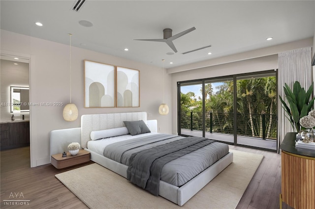 bedroom featuring visible vents, access to exterior, wood finished floors, and recessed lighting