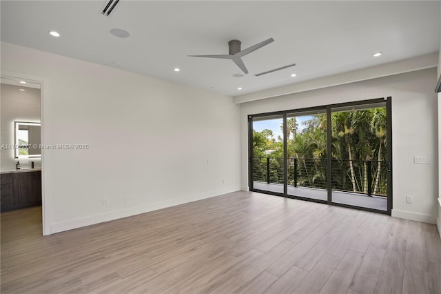 unfurnished room with ceiling fan, visible vents, baseboards, recessed lighting, and wood finished floors