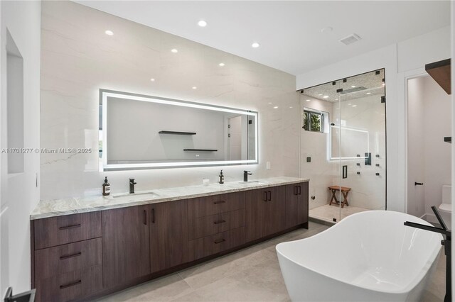 spacious closet with visible vents and light wood-style flooring