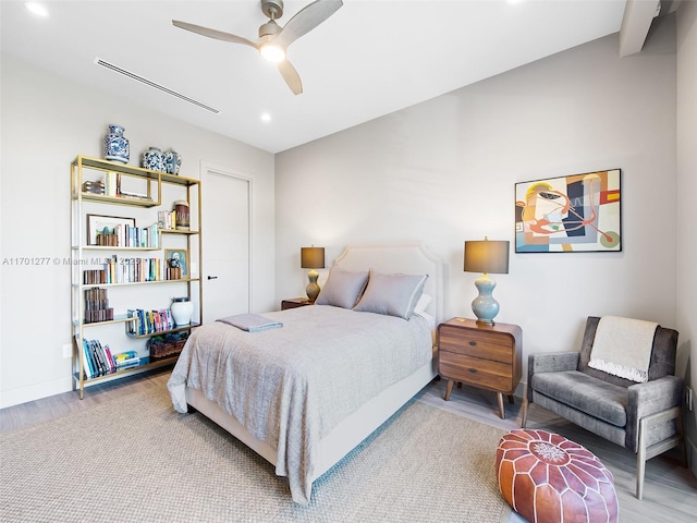 bedroom featuring baseboards, a ceiling fan, wood finished floors, and recessed lighting