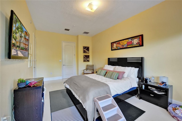 bedroom with a textured ceiling