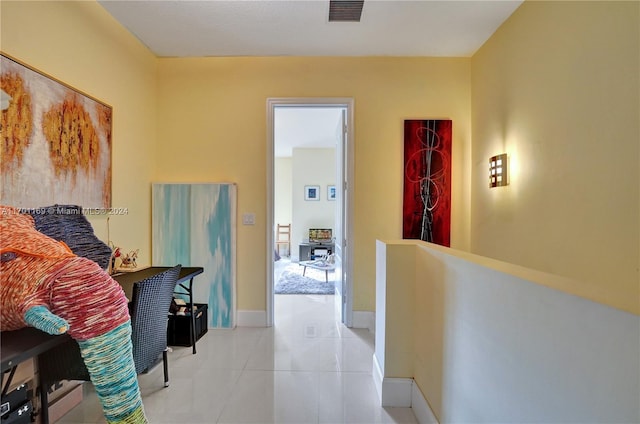 corridor featuring light tile patterned floors