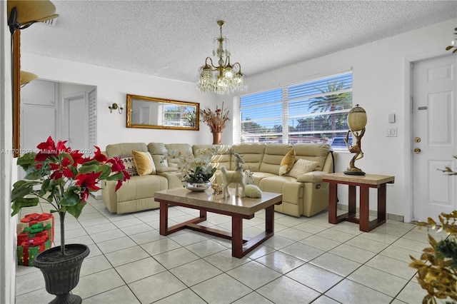 living room featuring a chandelier, light tile patterned floors, and a textured ceiling