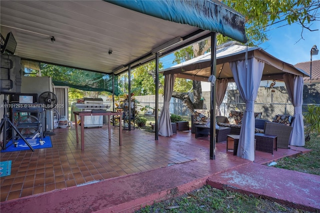 exterior space featuring a gazebo, outdoor lounge area, and a patio area