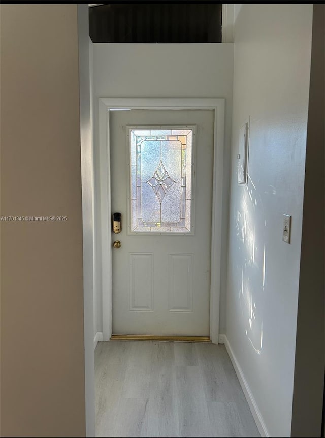 doorway featuring light hardwood / wood-style floors