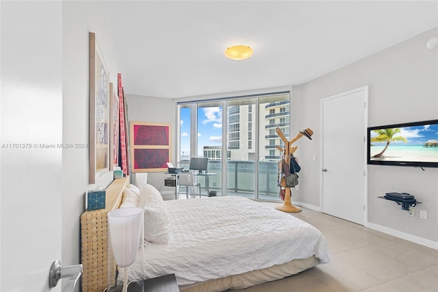 tiled bedroom featuring access to outside