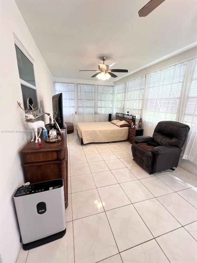 bedroom featuring ceiling fan and light tile patterned floors