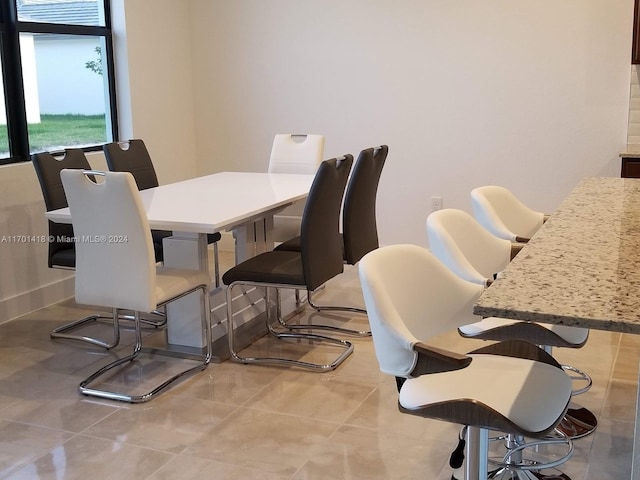 dining room with light tile patterned floors