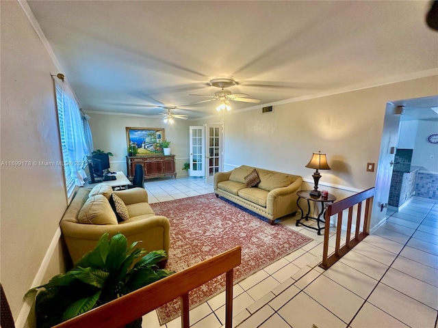 living room featuring french doors, ceiling fan, ornamental molding, and light tile patterned flooring