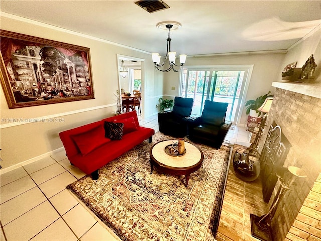 living room with plenty of natural light, light tile patterned floors, ornamental molding, and an inviting chandelier