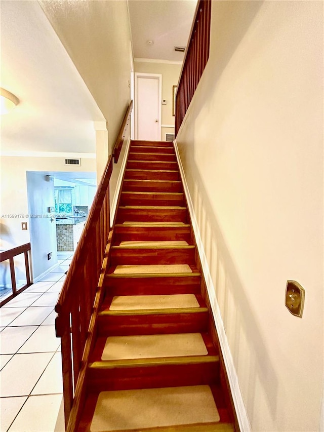 staircase with tile patterned flooring