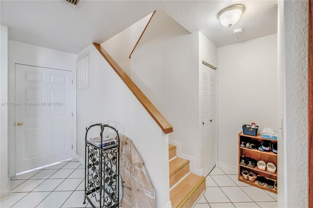 20935 SW 84th Ave Unit 20935, Cutler Bay, FL 33189 - staircase with tile patterned floors and baseboards