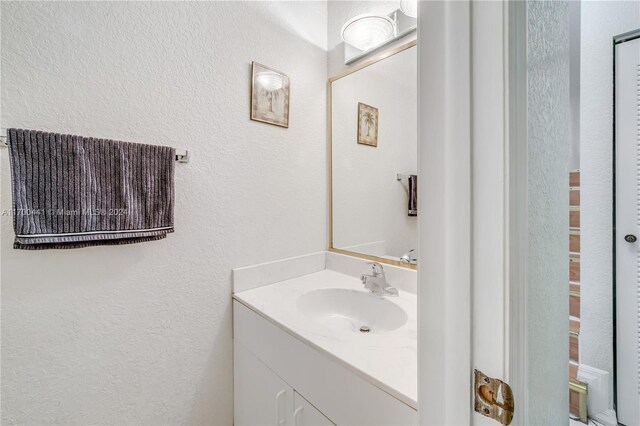 20935 SW 84th Ave Unit 20935, Cutler Bay, FL 33189 - bathroom featuring vanity and a textured wall